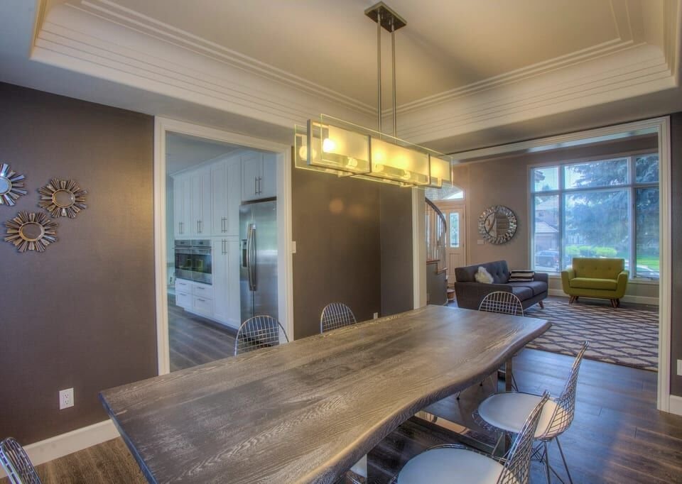 Dining room with a live-edge table under a linear chandelier