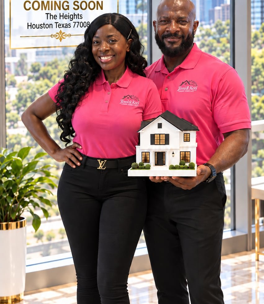 Temi and Keri holding a model of a white two-story home in front of their Coming Soon sign for The Heights