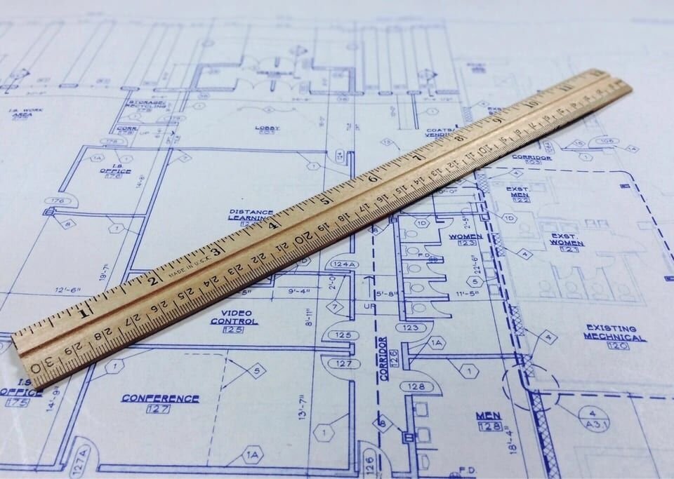 Blueprint with a wooden scale ruler