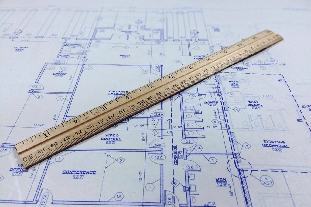 Blueprint with a wooden scale ruler