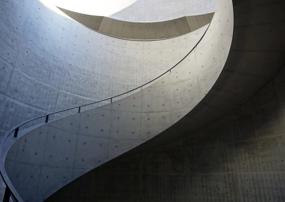 Sweeping curved staircase in soft light